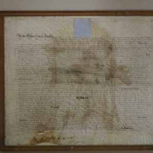 Poorly framed and water damaged parchment deed