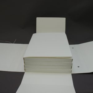 Intermediate folders are stored in a four flap box