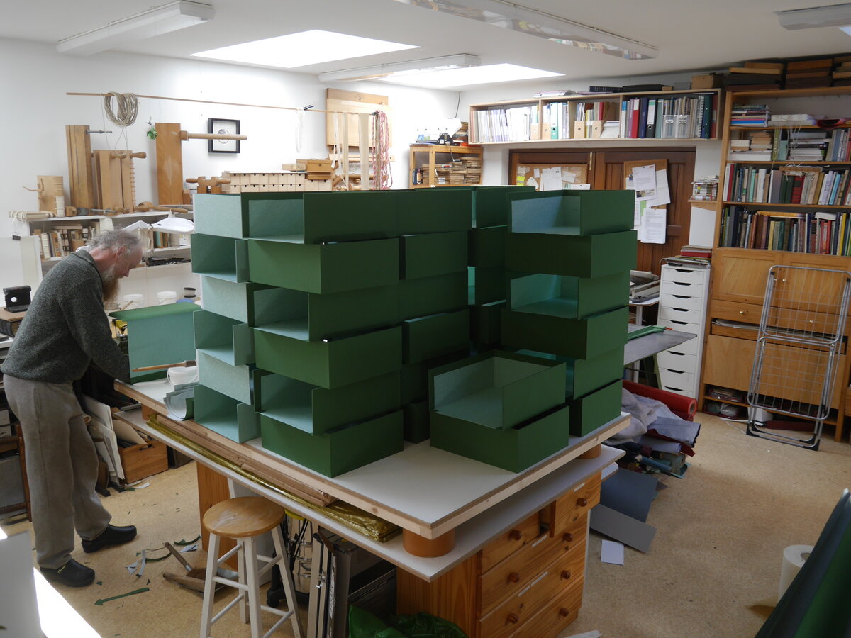 Stacks of box trays for assembly