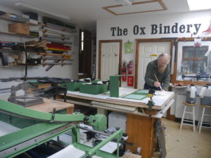 Covering box trays in green cloth